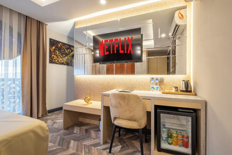 Classic Double Room, City View | Minibar, in-room safe, desk, iron/ironing board