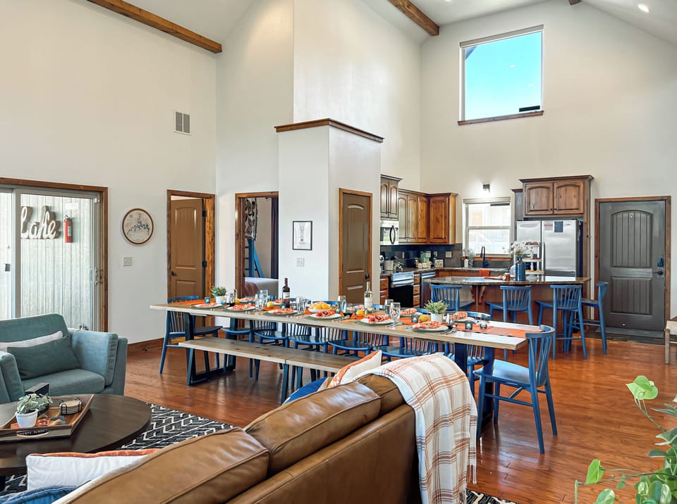 The living room and dining table are right next to the full size and fully stocked kitchen.