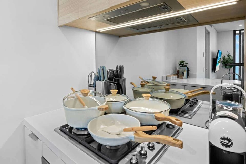 Fully-equipped kitchen with pots and pans, plus basic ingredients like oil, salt, and pepper for your convenience.