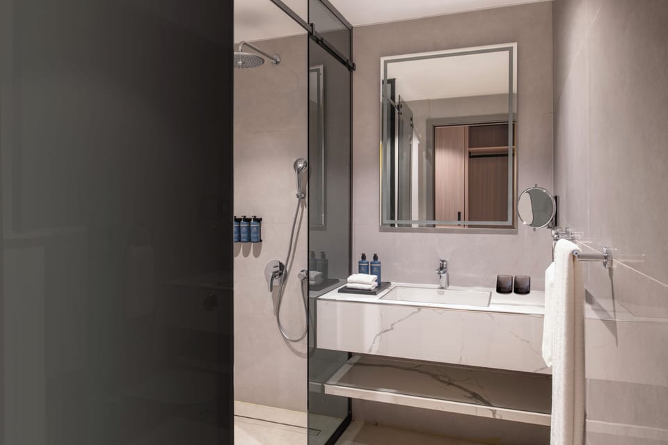 Shower, slippers, towels, soap