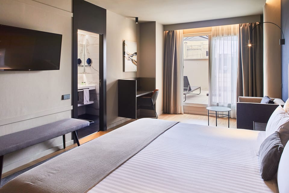 Deluxe Room, Terrace | Down comforters, minibar, in-room safe, desk