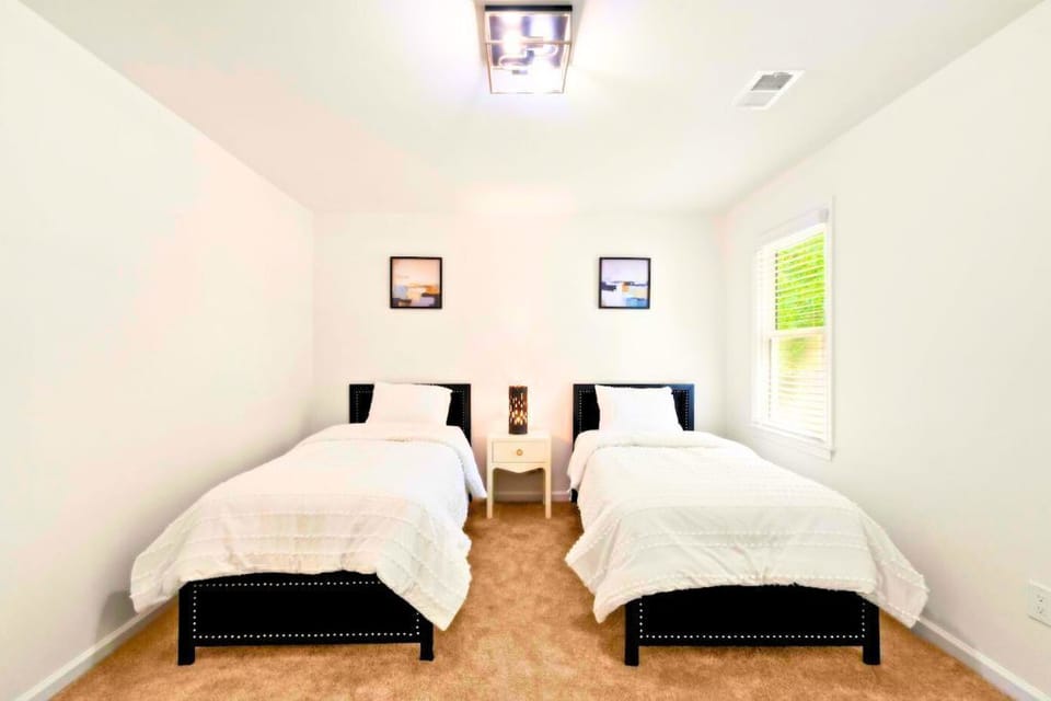 Perfect for kids or friends, this twin bedroom combines comfort.