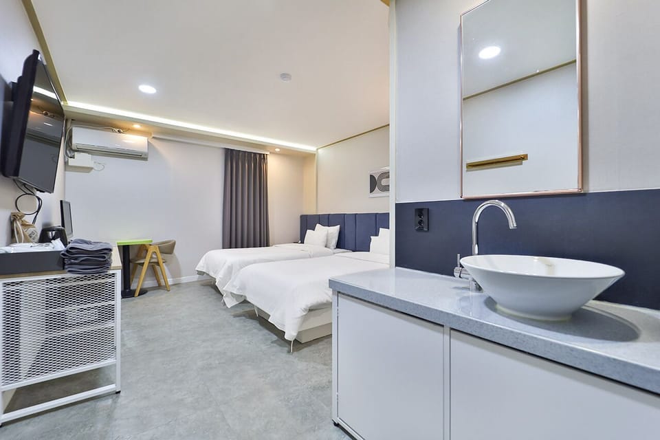 Premium bedding, desk, laptop workspace, soundproofing