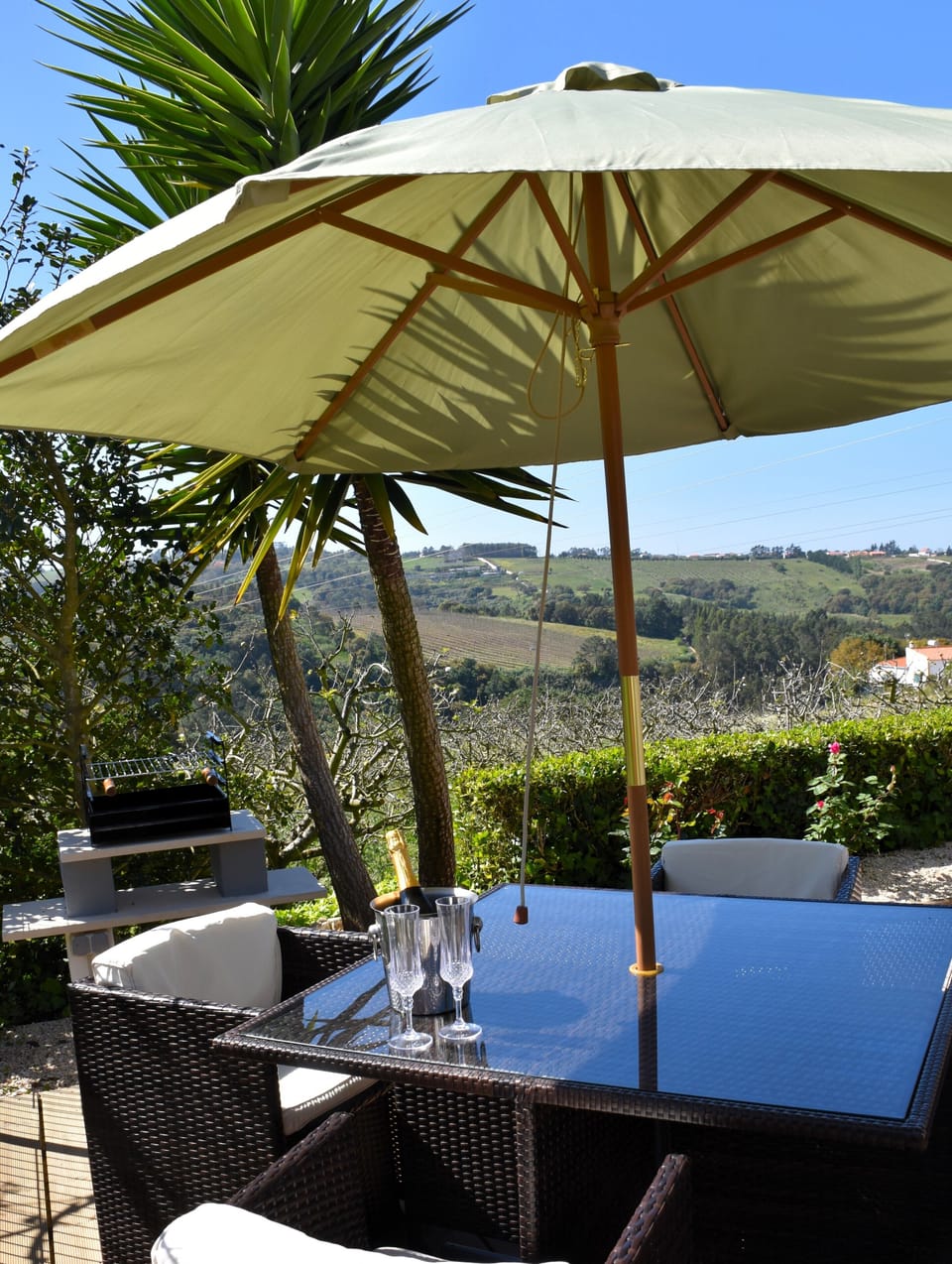 Outside sundeck with seating and outside BBQ
