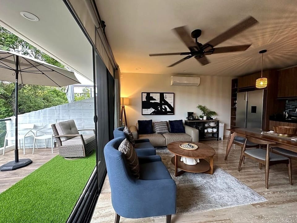 Living room opening to the private balcony

