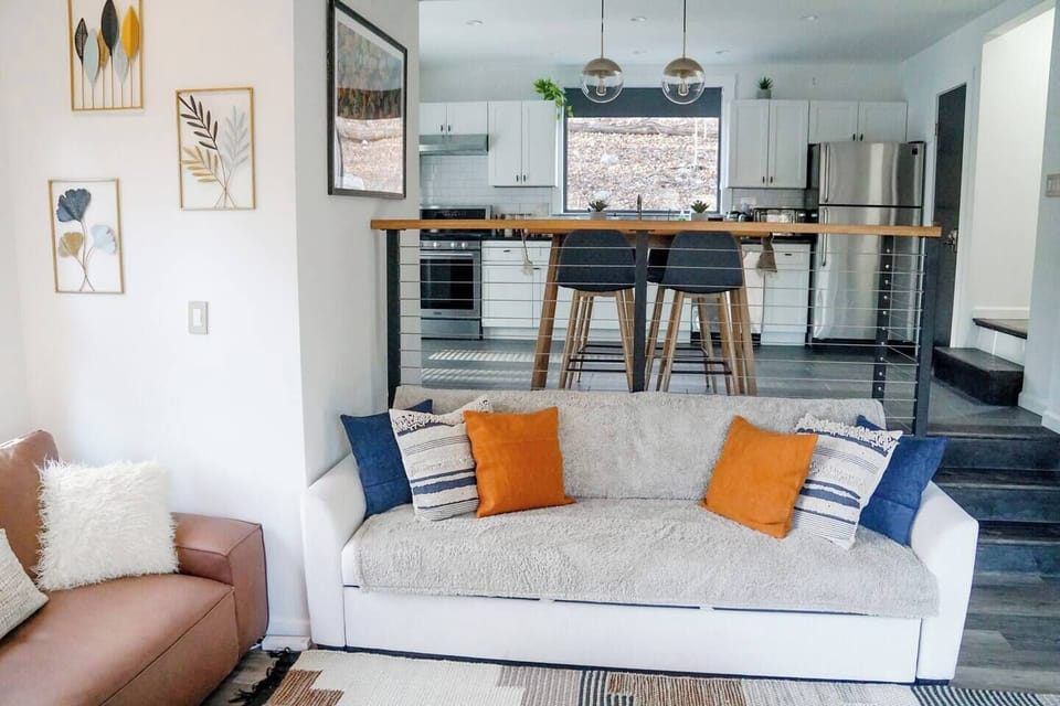 White, black and gold base colors with splash of blue and orange. You can follow this trend throw the entire house