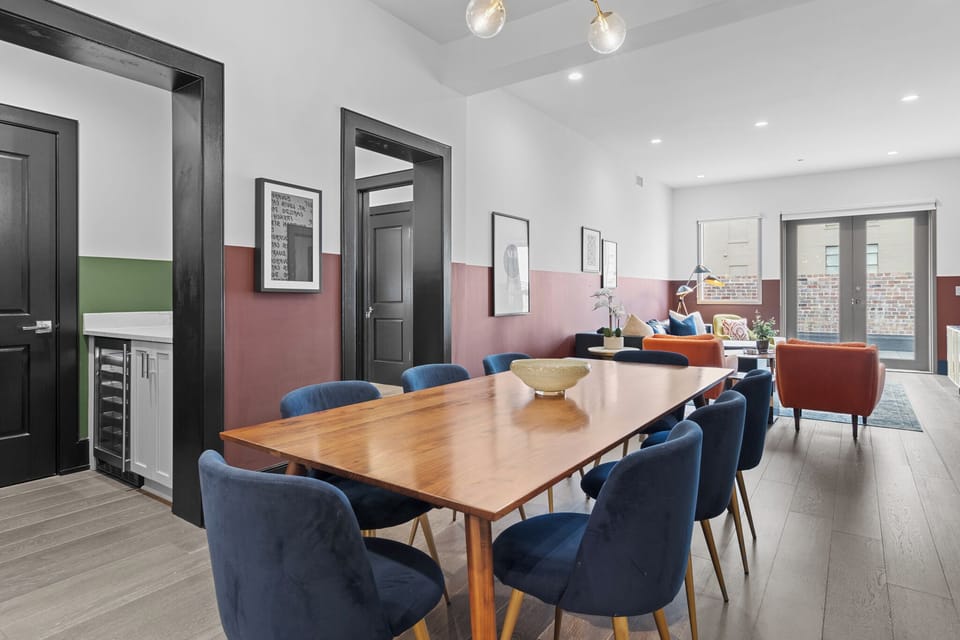 Enjoy meals together at your in-suite dining table with seating for your group. Whether it's takeout, delivery, or a home-cooked meal, this cozy dining area makes every stay at 888 Baronne feel like home in New Orleans.