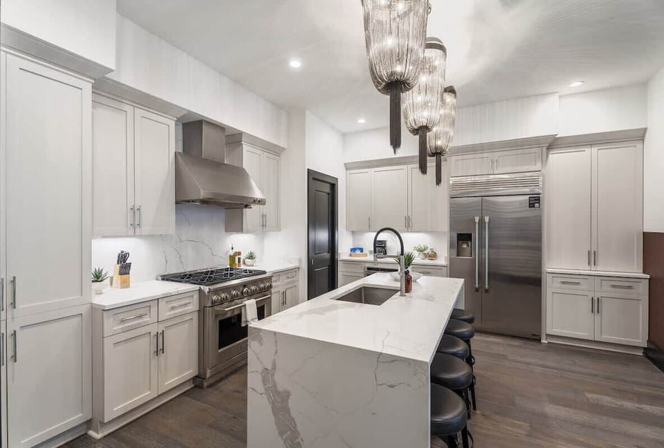 Cook or snack in style with a full kitchen featuring GE stainless appliances, cookware, and an island with bar seating. Ideal for short or extended stays, our kitchens make group travel in New Orleans easy and comfortable.