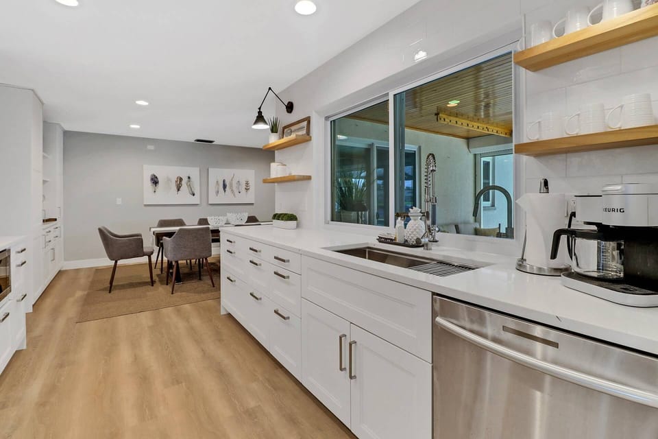 Cookware, dinnerware and many electrical appliances are provided, including a Keurig duo coffeemaker.