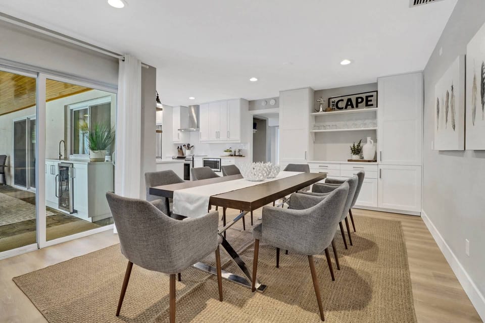 The dining room, with seating for 8, is adjacent to the kitchen and has direct lanai access through large sliding glass doors.