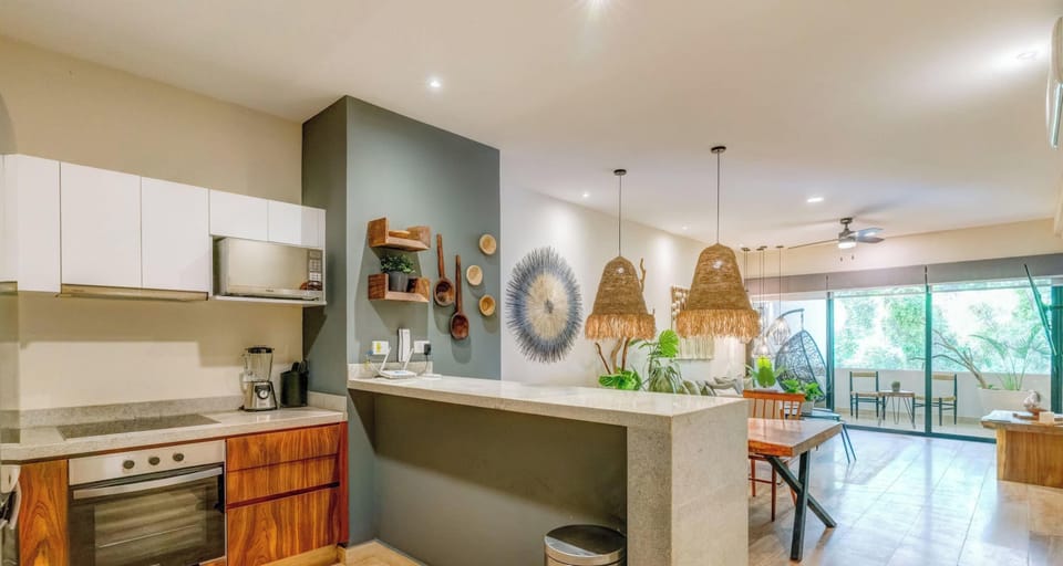Prep snacks, share laughs, and enjoy jungle-framed dining.