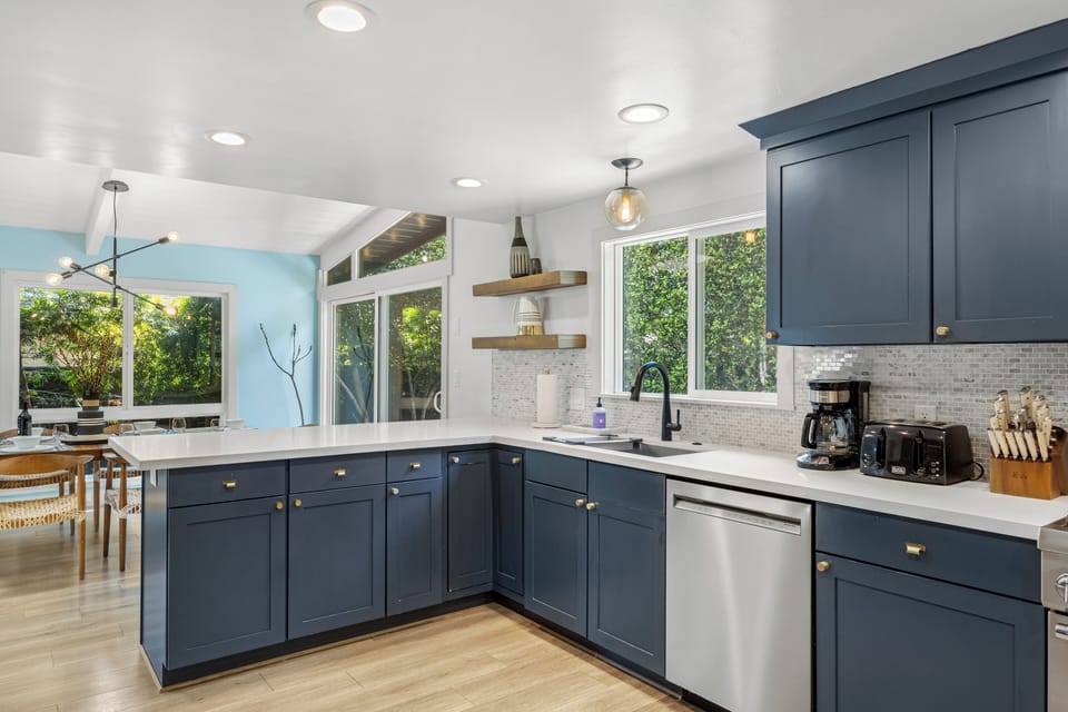 Fully equipped kitchen features stainless steel appliances.