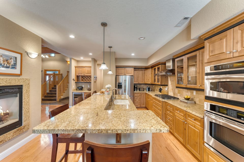 Large kitchen island with barstool seating.