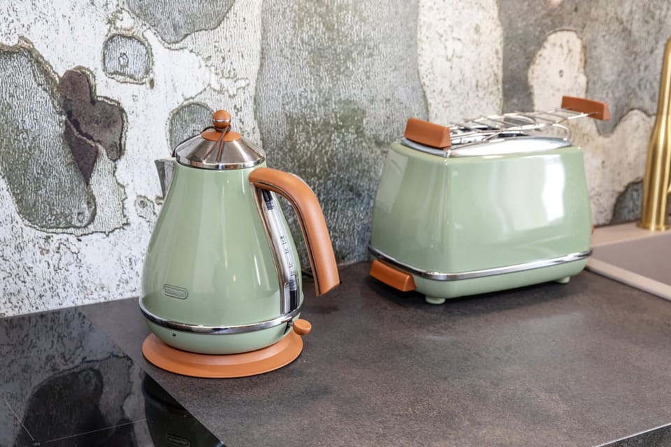 Stylish and functional retro kitchen appliances, including a matching kettle and toaster for your daily convenience.