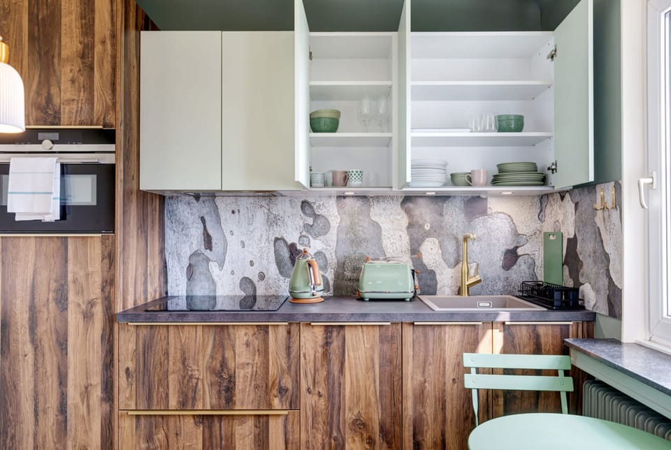 Fully stocked kitchen with oven, stove, and plenty of counter space for all your cooking needs during your stay.