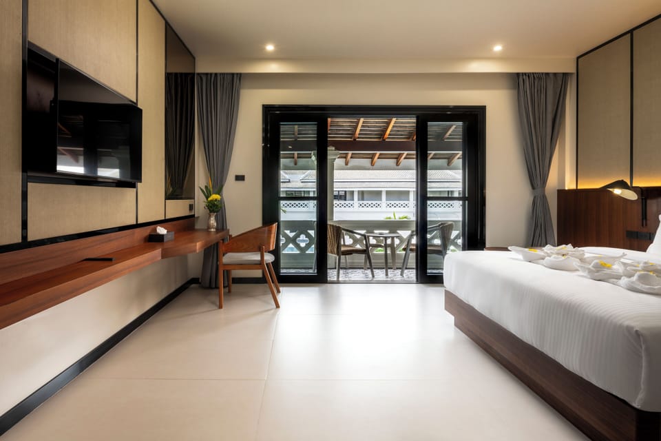 Deluxe Double Room, Balcony, Pool View | In-room safe, desk, laptop workspace, iron/ironing board