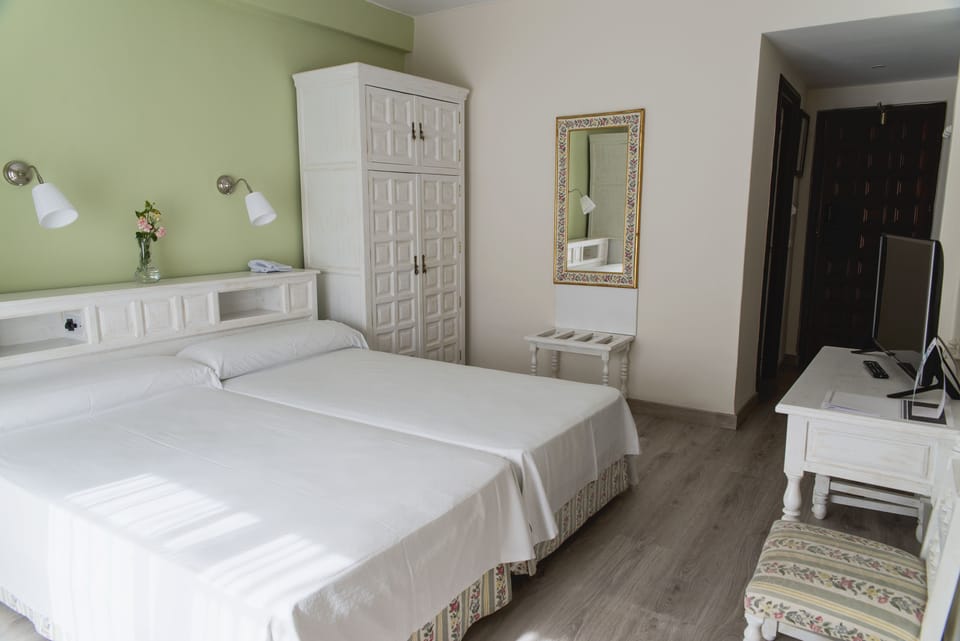 Desk, laptop workspace, free WiFi, bed sheets