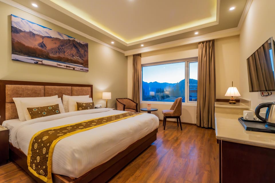 Premium bedding, desk, laptop workspace, blackout drapes