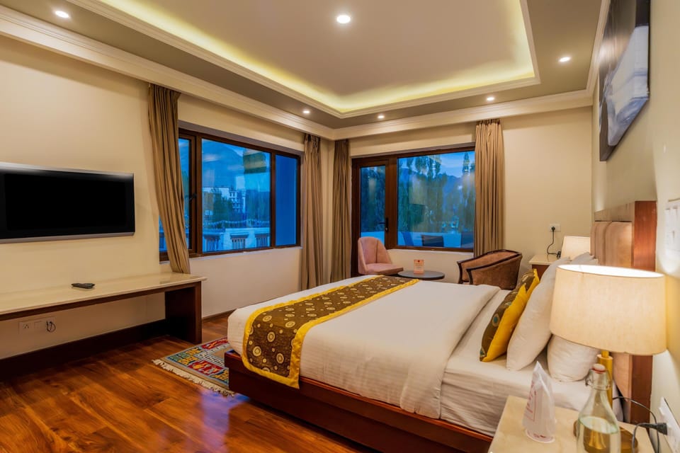 Premium bedding, desk, laptop workspace, blackout drapes