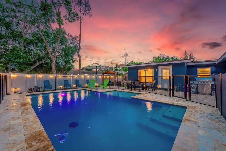 String lights and pool light create a magical atmosphere against the beautiful dawn and dusk sky.