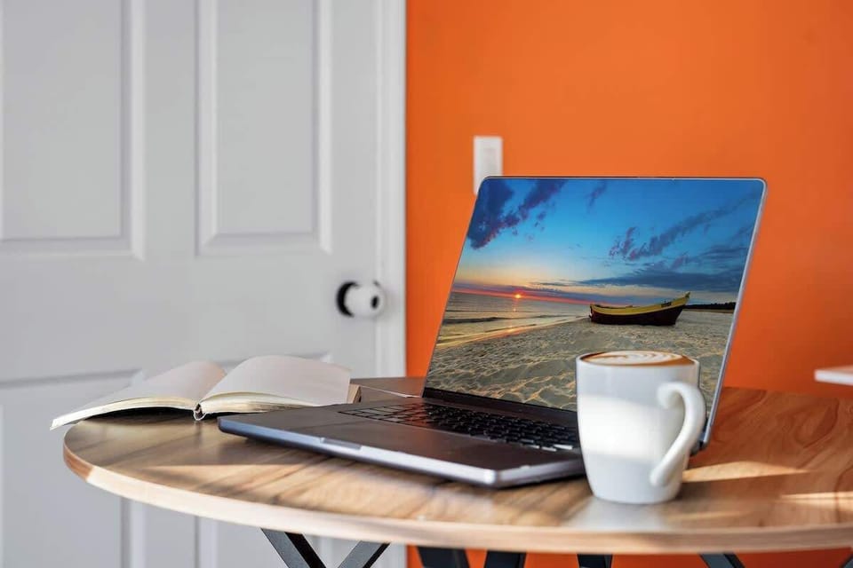 Start your day with a cup of coffee and a peaceful workspace at the breakfast table.