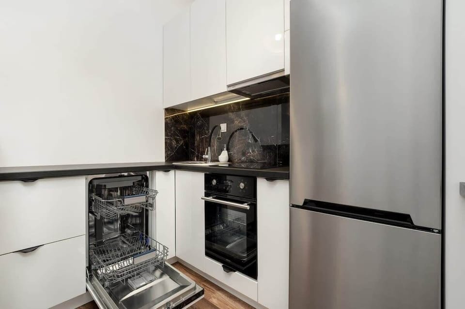 Includes oven, stove, dishwasher, and a large refrigerator. Everything you need for short or extended stays.

