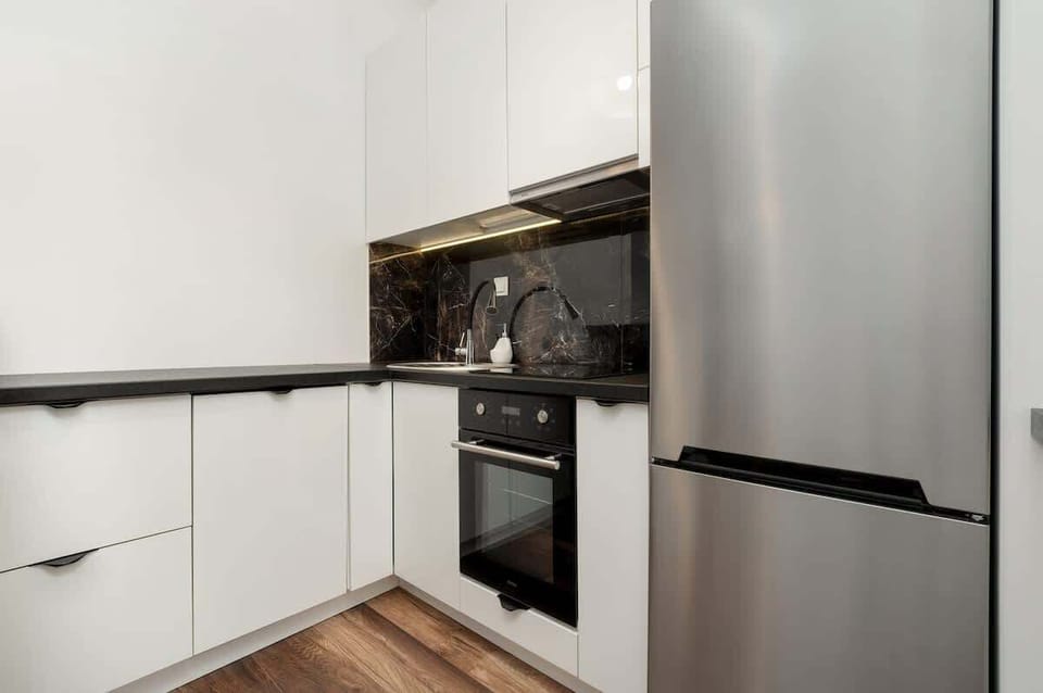 A sleek, modern kitchen with all essential appliances and a convenient layout for quick meal prep.

