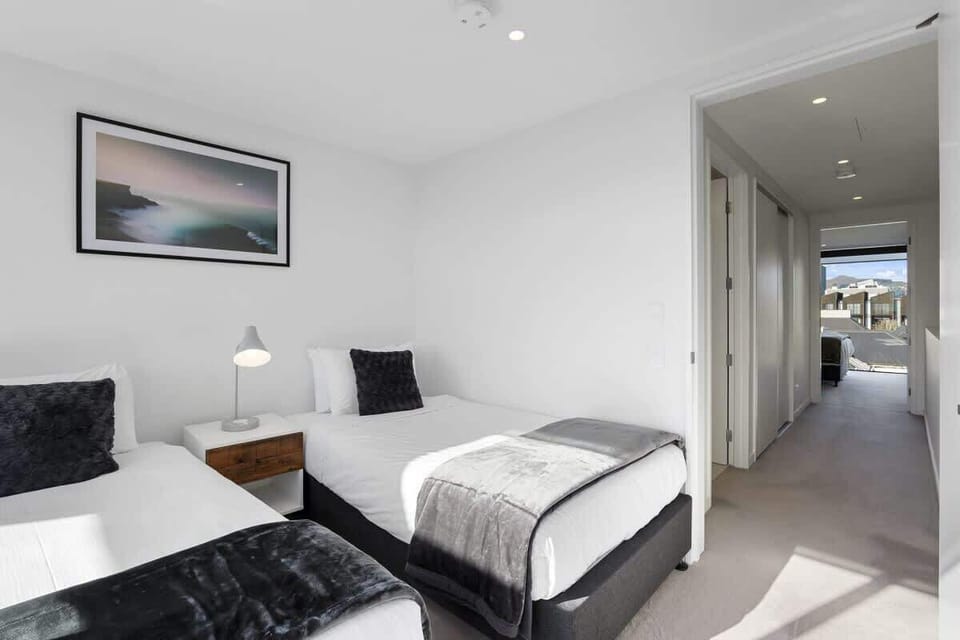 Rear bedroom upstairs with two single beds.