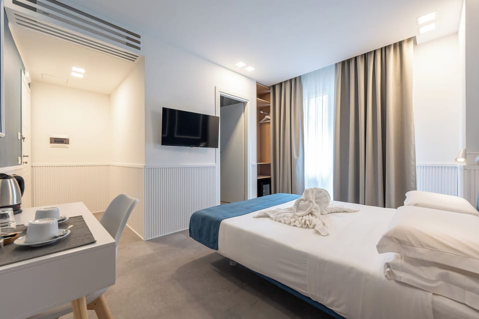 Deluxe Double Room, Balcony, City View | In-room safe, blackout drapes, soundproofing, iron/ironing board