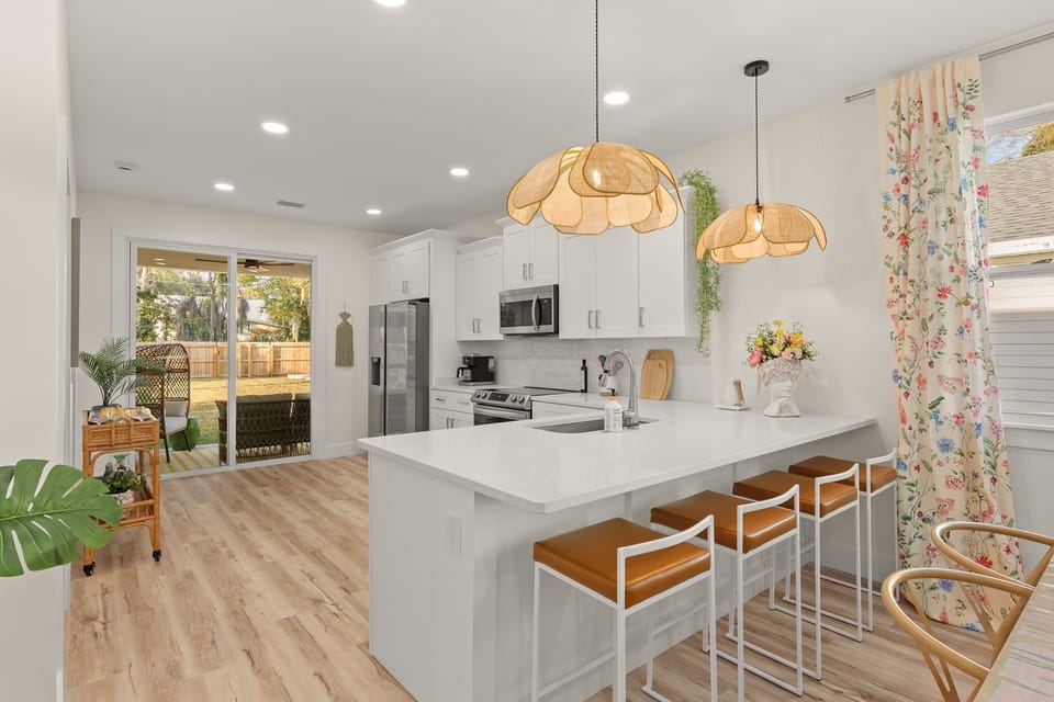 Bright and airy space with stylish seating and views of the lush backyard oasis!