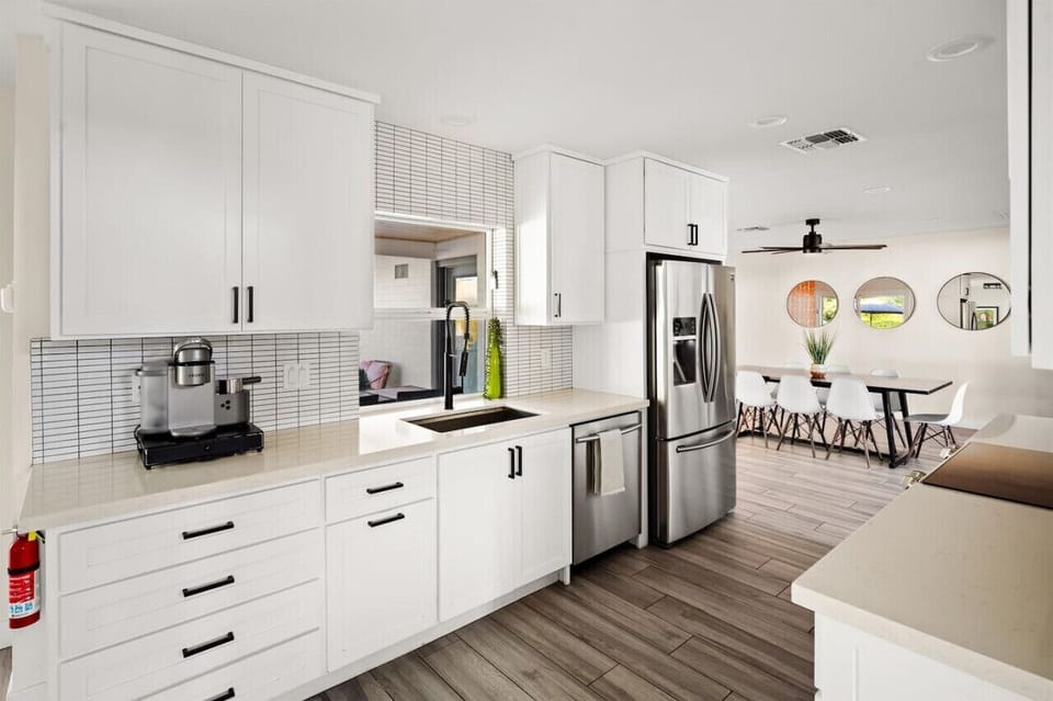 Cook with ease in this sleek, fully equipped kitchen that opens to a bright dining space.