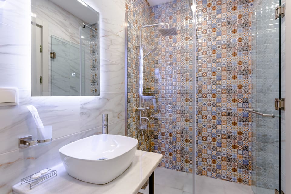 Shower, hair dryer, slippers, towels