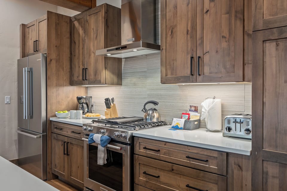 - Everything you need to cook is at your fingertips in this fully equipped kitchen setup - Stainless steel gas range, toaster, kettle, blender, and coffee maker are ready to go