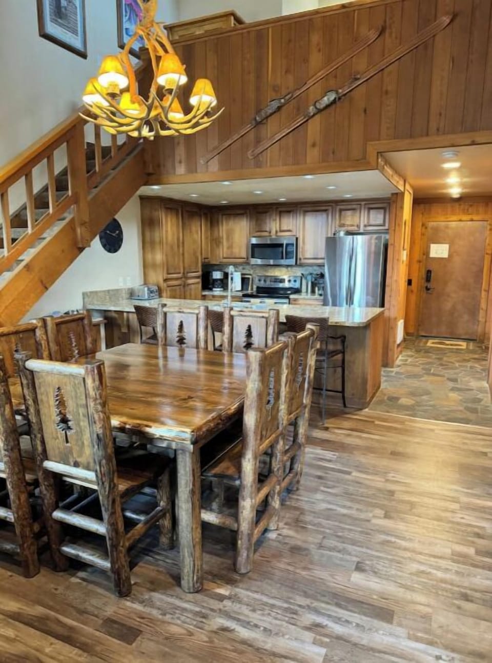 Dining table with seats for 8, and an additional 3 bar seats with backs.