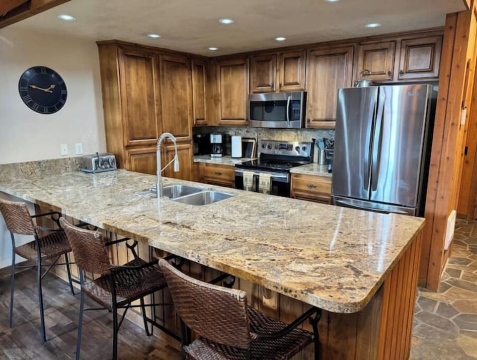 Large kitchen island with bar seating.