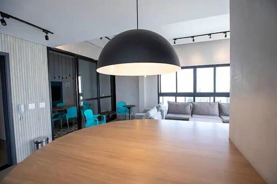 Basic Studio, Balcony, City View | Living area | Flat-screen TV