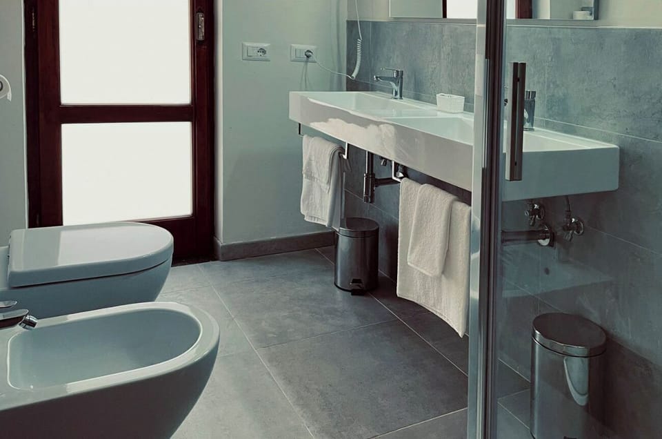 Comfort Room, Garden View | Bathroom | Hair dryer, towels, soap, shampoo