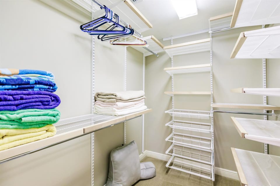 Walk-in closet in master bedroom.  Additional blankets & beach towels provided.