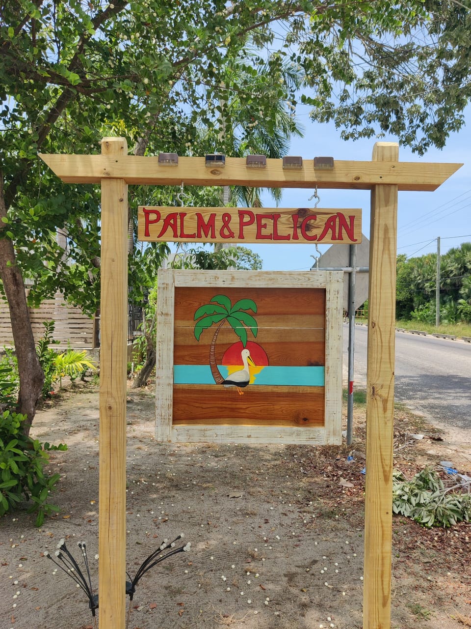 Palm&Pelican sign