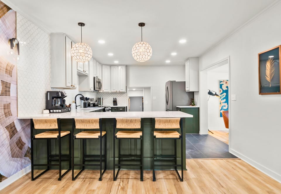 Gathering around the oversized kitchen island is easy here, with plenty of seating for meals, snacks, and conversation throughout the day.