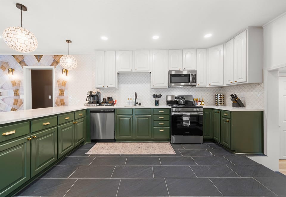 The sleek, spacious kitchen is ideal for both cooking and socializing, offering a perfect blend of form and function.