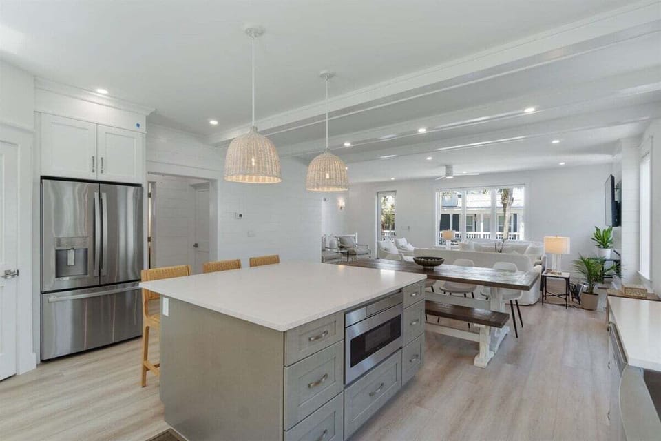 Oversized quartz island and stainless appliances in our fully stocked kitchen