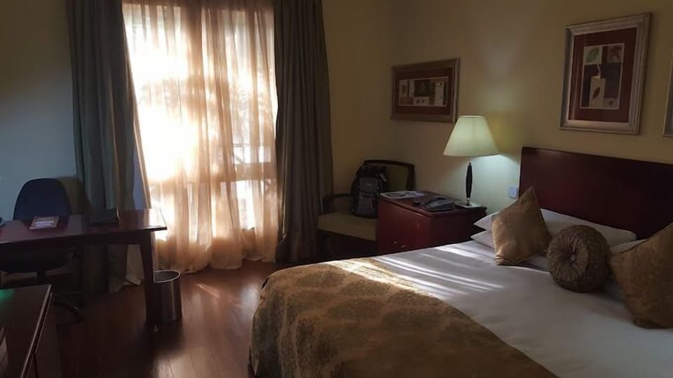 Deluxe Room, Balcony, City View | Desk, laptop workspace, free WiFi