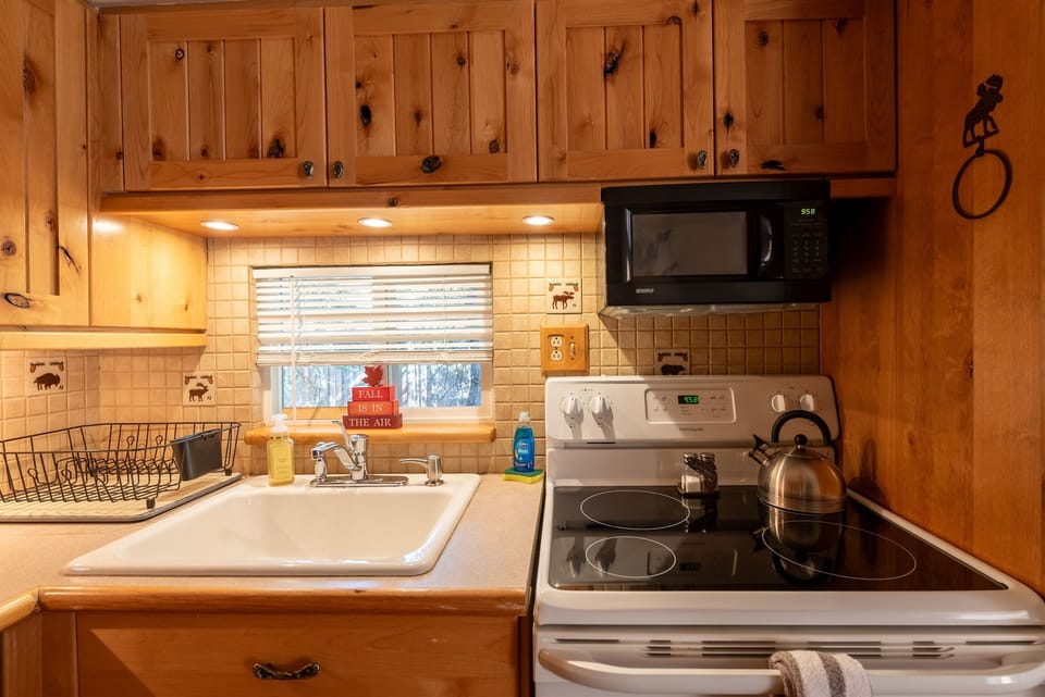 Fully stocked kitchen, including an air fryer, large crockpot, electric griddle, and waffle maker