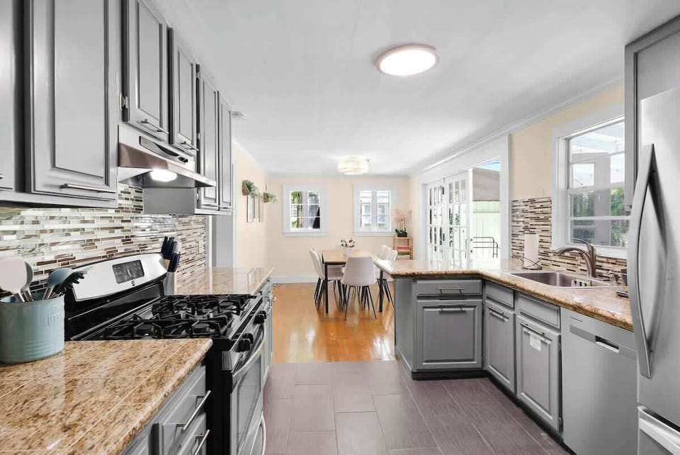 Fully Stocked Kitchen. Stainless steel fridge with ice. Gas stove. Dishwasher. Microwave (not shown in photo). Dinnerware for 16 - plates, bowls, and silverware. Mugs, glasses, plastic cups. Fire Extinguisher and first aid kit underneath sink. 