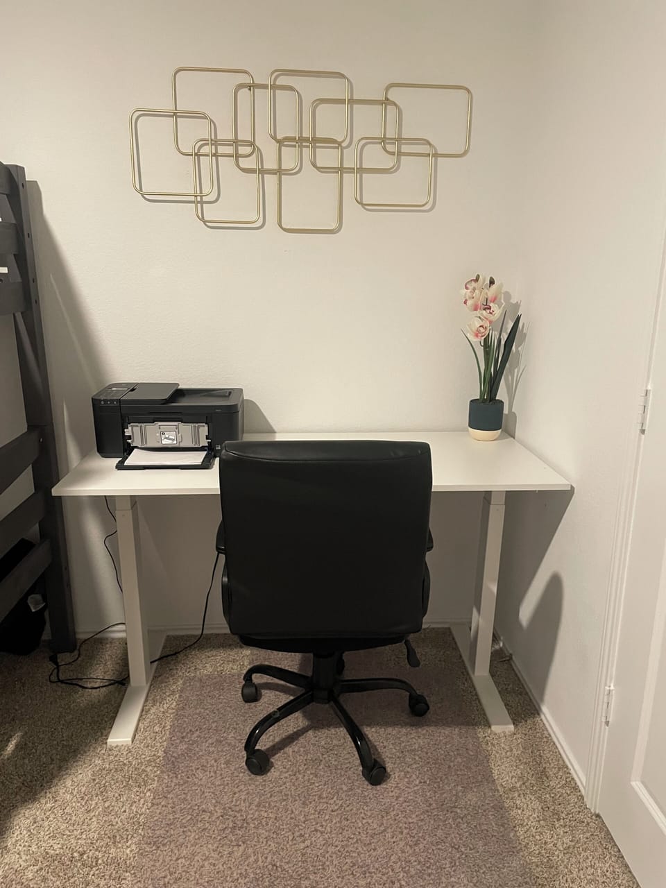 Adjustable height desk, chair, printer, and white board