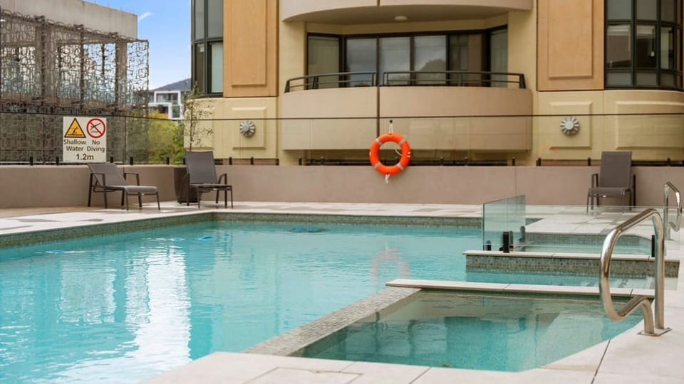 Enjoy a refreshing swim in the sparkling shared pool, steps from your door.