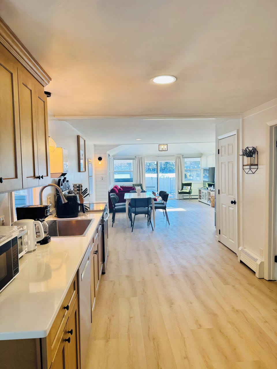 Kitchen overlooking dining area, living room, and into the lake