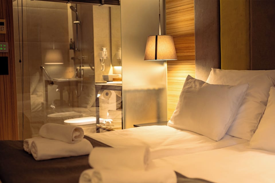 Deluxe Triple Room, Balcony, Courtyard View | In-room safe, desk, laptop workspace, blackout drapes