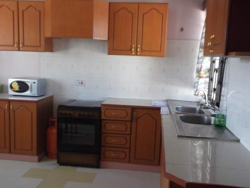 Family Villa, Balcony, Garden View | Private kitchen | Fridge, microwave, cookware/dishes/utensils, dining tables